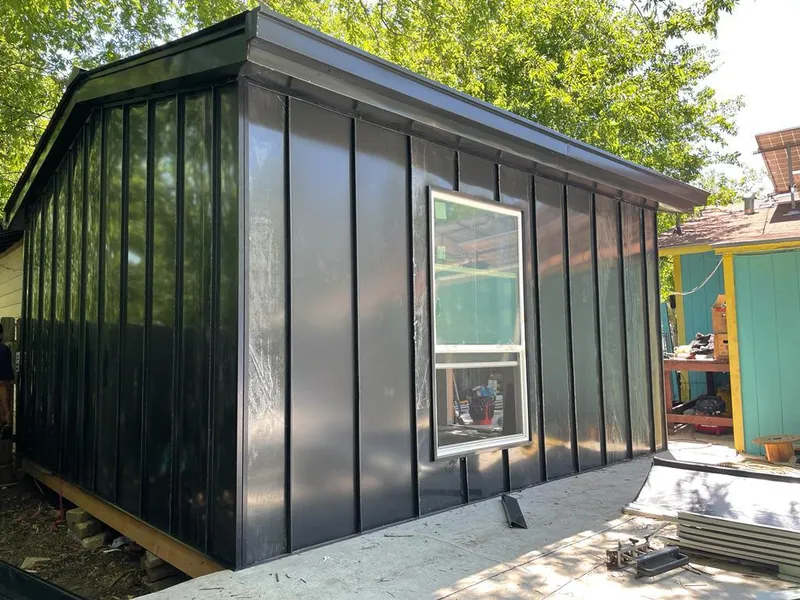 Black standing seam metal wall panels for Roof Inspection in Air Force Academy